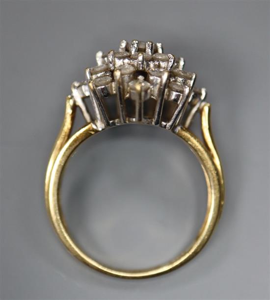 A modern 18ct gold and diamond cluster ring, size J, gross 4.2 grams.